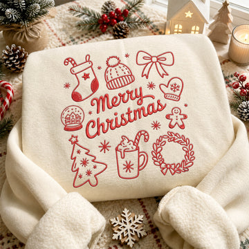 Cream sweatshirt with red embroidered Merry Christmas text surrounded by festive holiday doodles including hot cocoa, gingerbread man, beanie, and Christmas wreath.