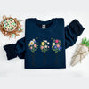 Navy blue sweatshirt with floral designs and text on a white background