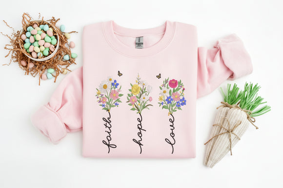 Light blue sweatshirt with floral designs and text on a white background