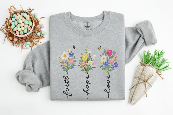 grey sweatshirt with floral designs and text on a white background