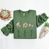 Green sweatshirt with floral designs and text on a white background